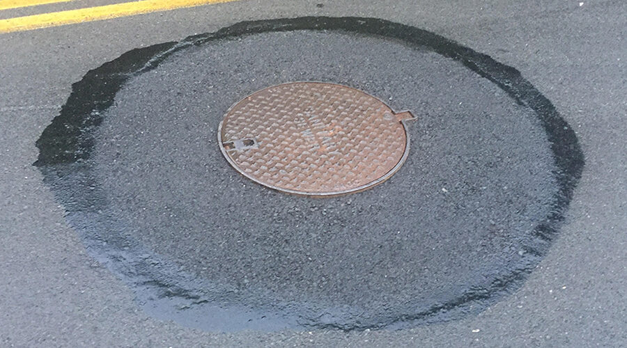 ez-street-asphalt-has-you-drain-surrounded